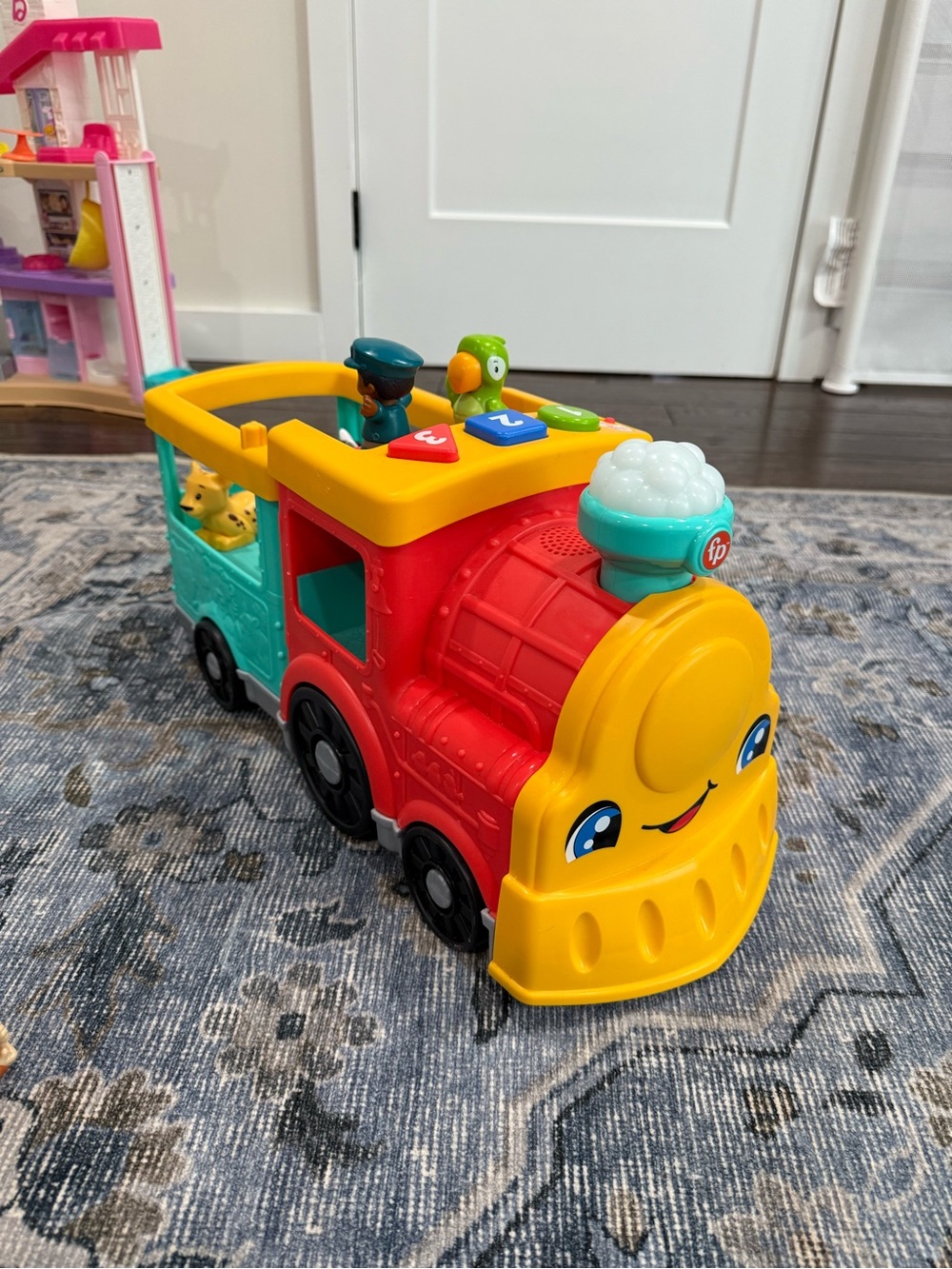 Fisher-Price Bright Multi‑Color Push Train Toy with Friendly Face